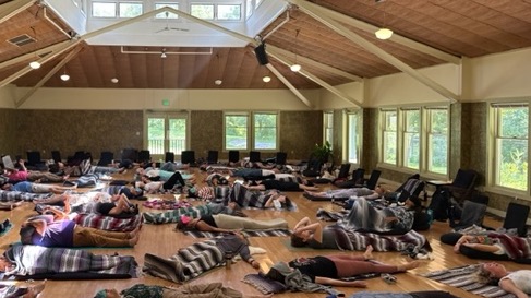 large group practicing breathwork